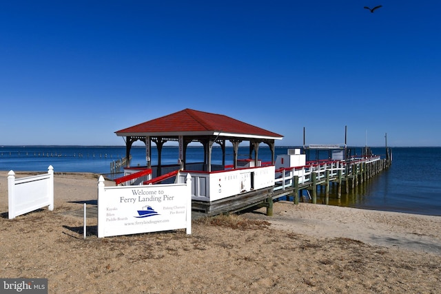 dock area with a view of the beach and a water view