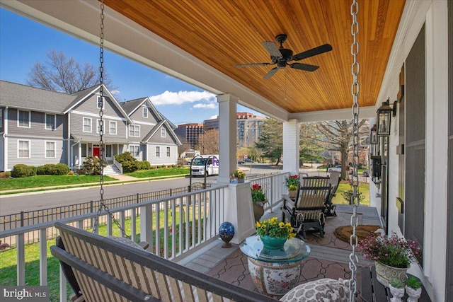 wooden deck featuring ceiling fan and a porch