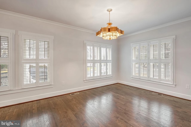 spare room featuring crown molding, an inviting chandelier, and dark hardwood / wood-style flooring