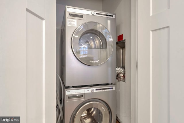 laundry area with stacked washer / drying machine