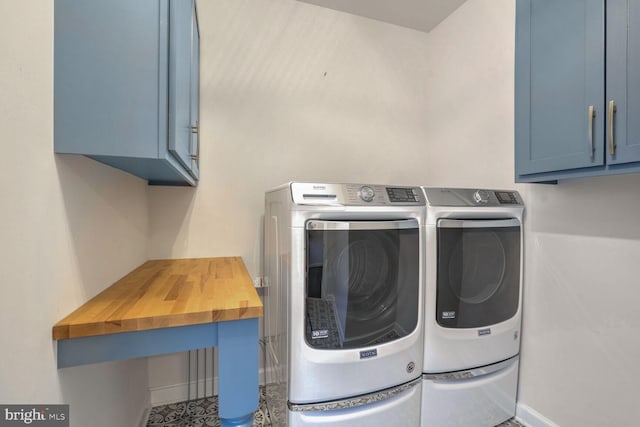 laundry room featuring cabinets and independent washer and dryer