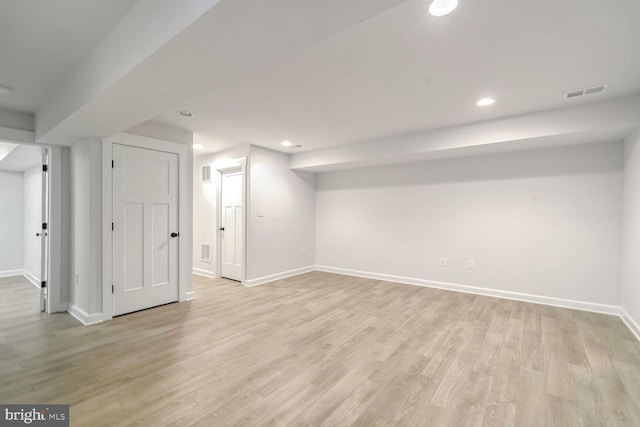 basement featuring light hardwood / wood-style floors