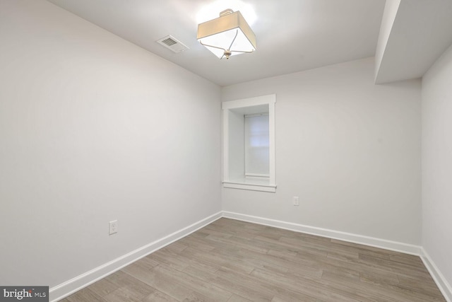 spare room with light wood-type flooring