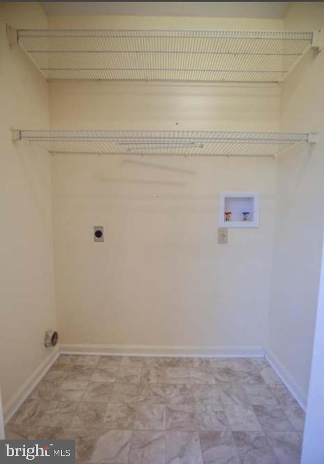 washroom with washer hookup and hookup for an electric dryer