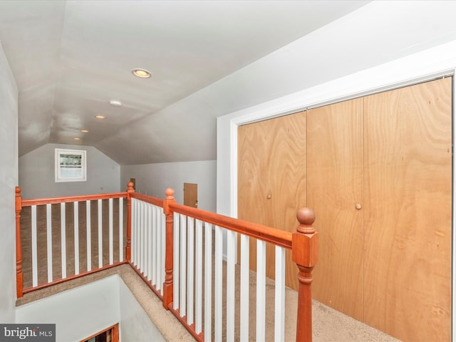 interior space with lofted ceiling and carpet floors