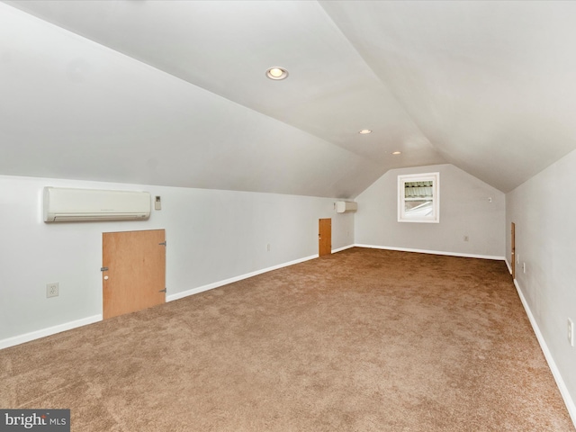 bonus room featuring carpet floors, vaulted ceiling, and an AC wall unit