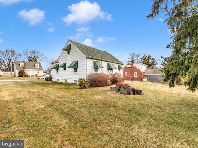 view of property exterior featuring a yard