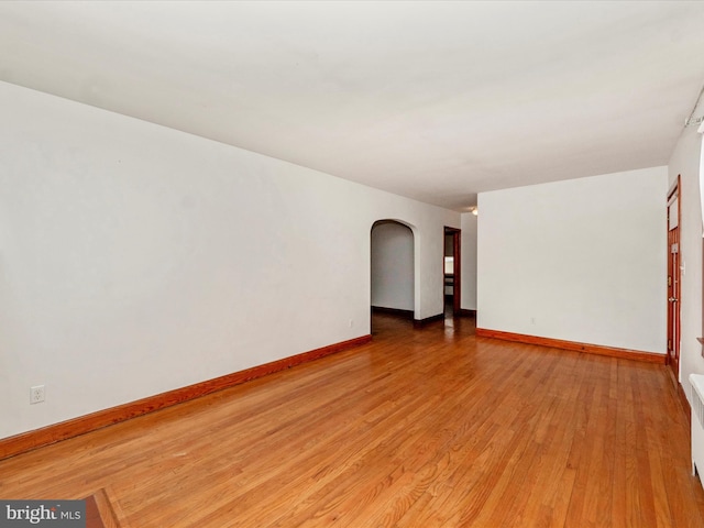 spare room with light wood-type flooring