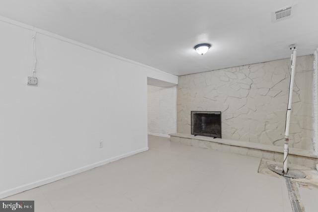 basement featuring a fireplace