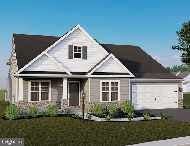 view of front of house featuring a garage and a front lawn