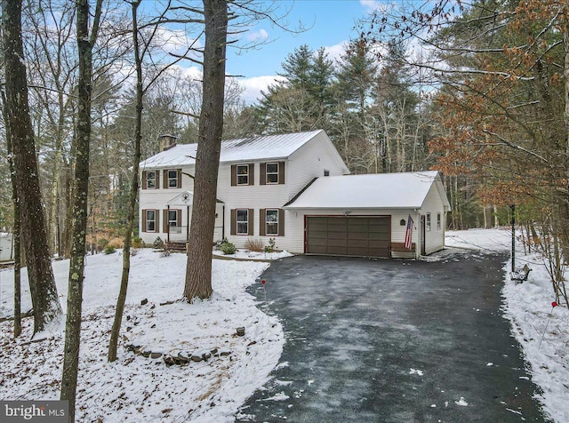 colonial inspired home featuring a garage