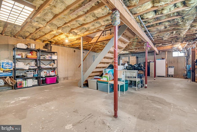 basement with white fridge