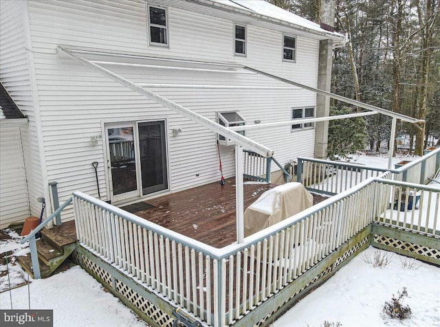 view of snow covered deck