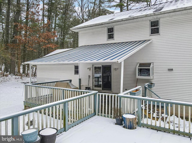 view of snow covered deck