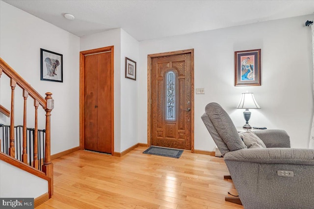 foyer entrance with light hardwood / wood-style flooring