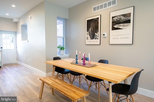 dining area with light hardwood / wood-style floors