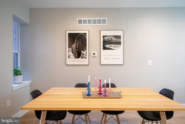 dining room with light hardwood / wood-style floors