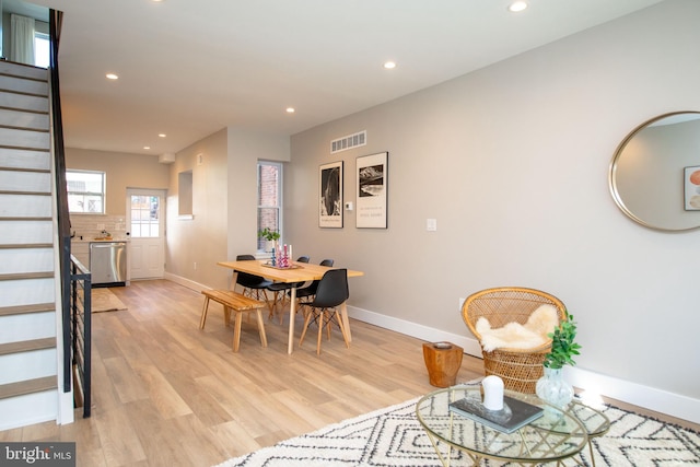 dining space with light hardwood / wood-style floors