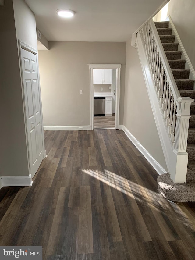 hallway featuring dark wood-type flooring