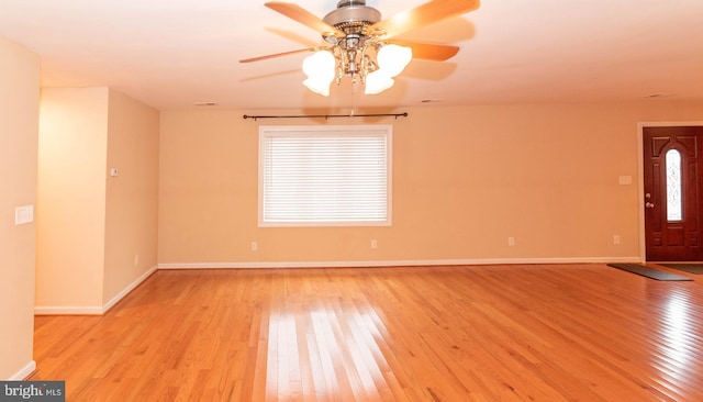 unfurnished room featuring ceiling fan and light hardwood / wood-style floors