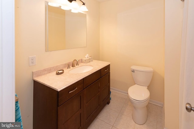 bathroom featuring vanity, toilet, and tile patterned flooring