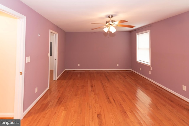 spare room with ceiling fan and light hardwood / wood-style floors