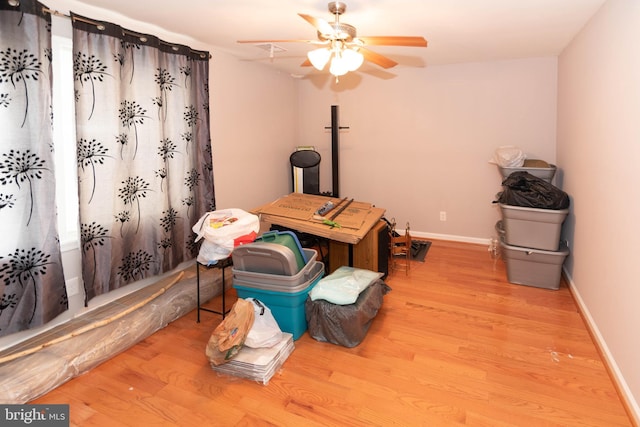 miscellaneous room with ceiling fan and light hardwood / wood-style floors