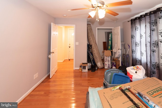 miscellaneous room featuring ceiling fan and light wood-type flooring