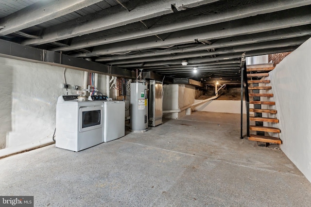 basement with washer and dryer and water heater