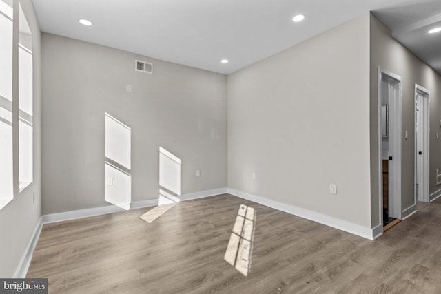 unfurnished room featuring hardwood / wood-style floors