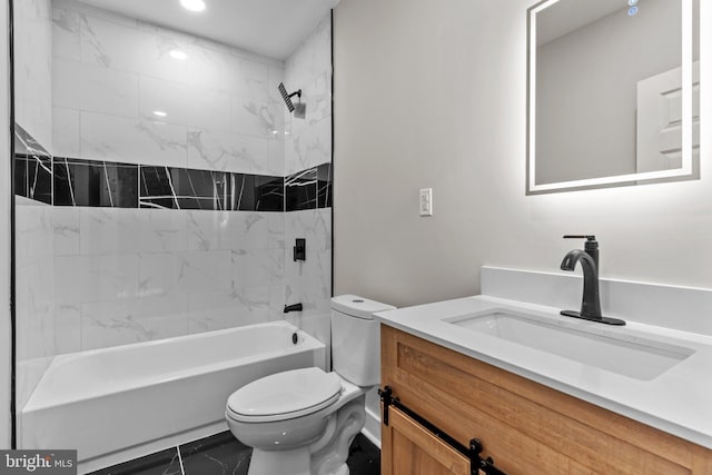 full bathroom featuring tiled shower / bath, vanity, and toilet