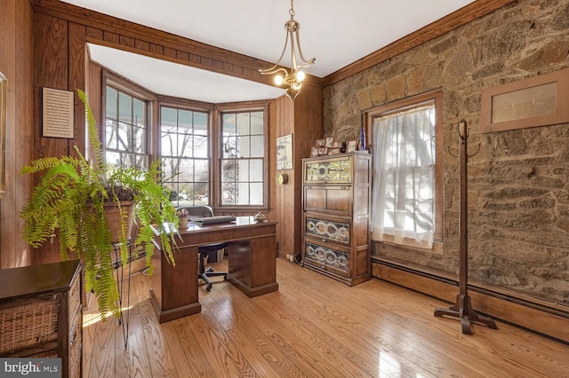 home office with a chandelier, light wood finished floors, and crown molding