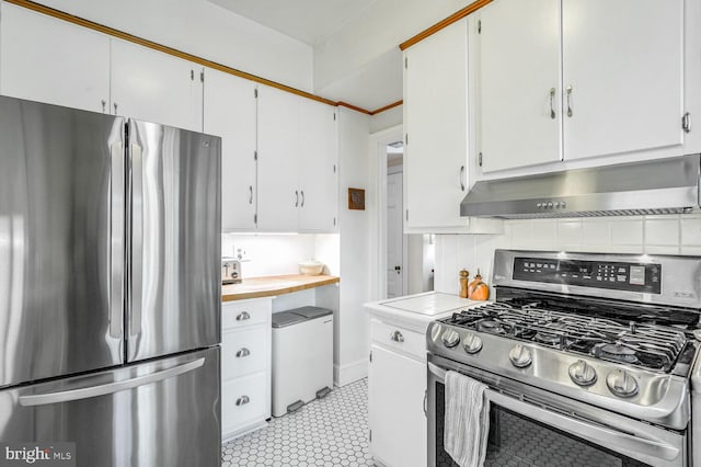 kitchen with under cabinet range hood, white cabinetry, stainless steel appliances, and light countertops