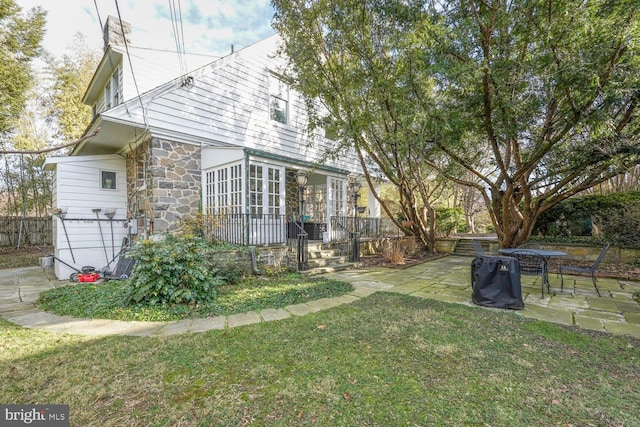 view of yard featuring a patio area and fence