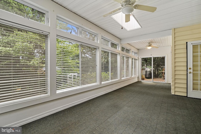 unfurnished sunroom featuring a healthy amount of sunlight and ceiling fan