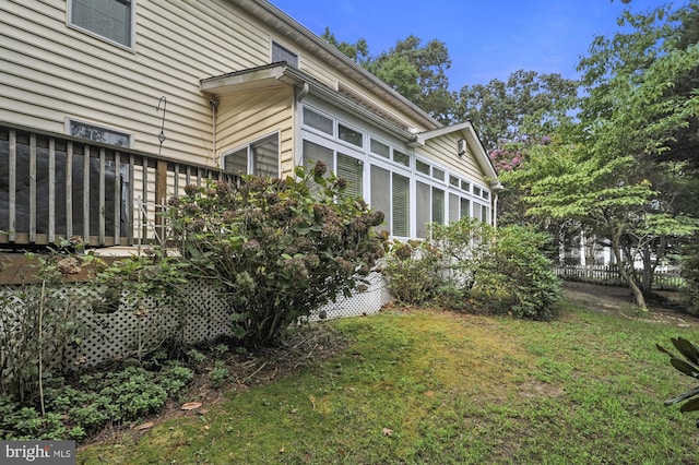 view of property exterior featuring a yard