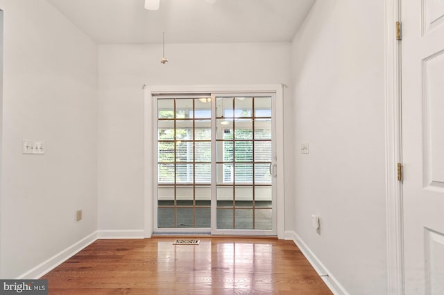 empty room with light hardwood / wood-style floors