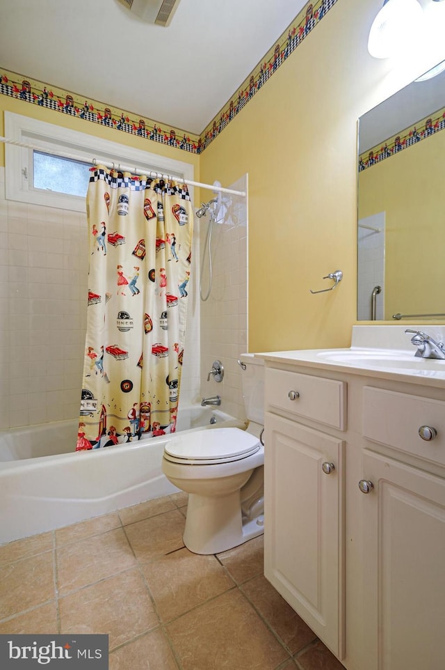 full bathroom with shower / tub combo with curtain, vanity, toilet, and tile patterned floors