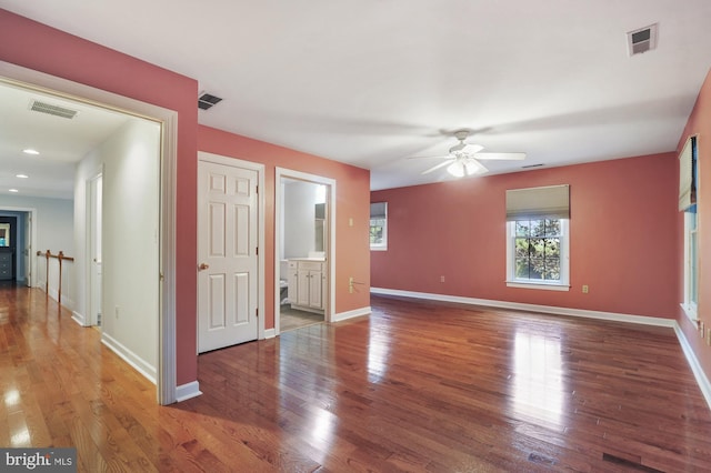 interior space featuring wood-type flooring and ceiling fan