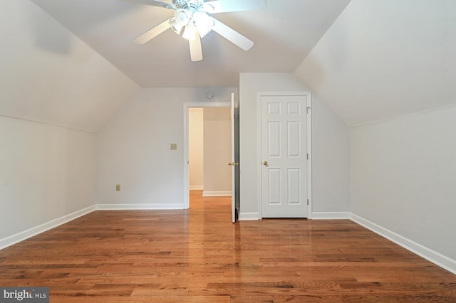 bonus room with hardwood / wood-style flooring, ceiling fan, and lofted ceiling