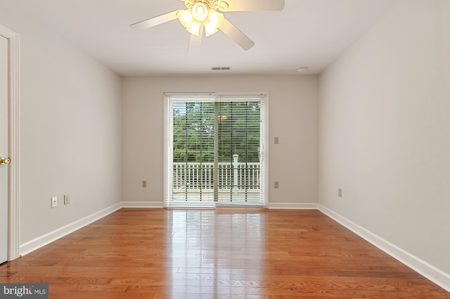 empty room with light hardwood / wood-style floors and ceiling fan