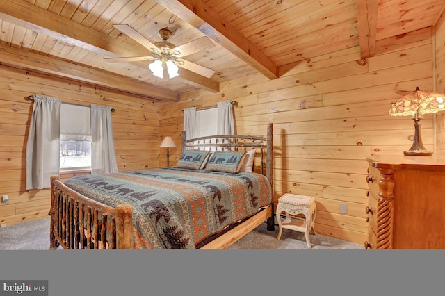 bedroom featuring wood ceiling, wooden walls, carpet flooring, beamed ceiling, and ceiling fan