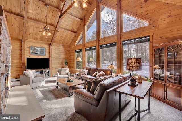 living room with wood ceiling, ceiling fan, carpet, beamed ceiling, and wood walls