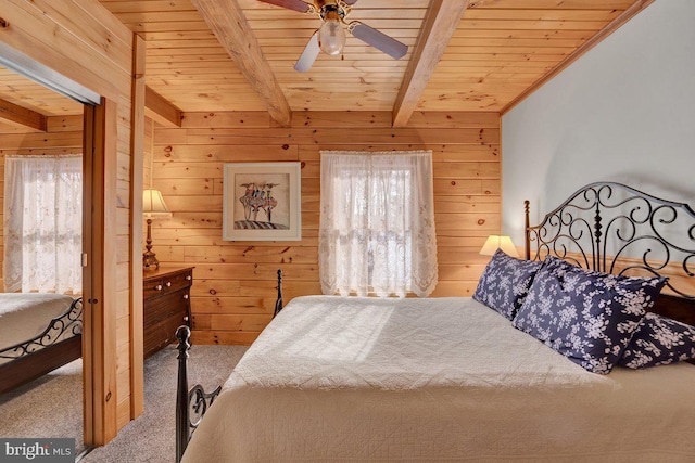 bedroom featuring multiple windows, wood ceiling, and beam ceiling