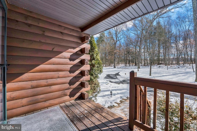 view of snow covered deck