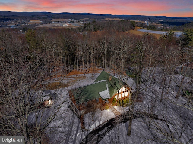 aerial view at dusk with a mountain view