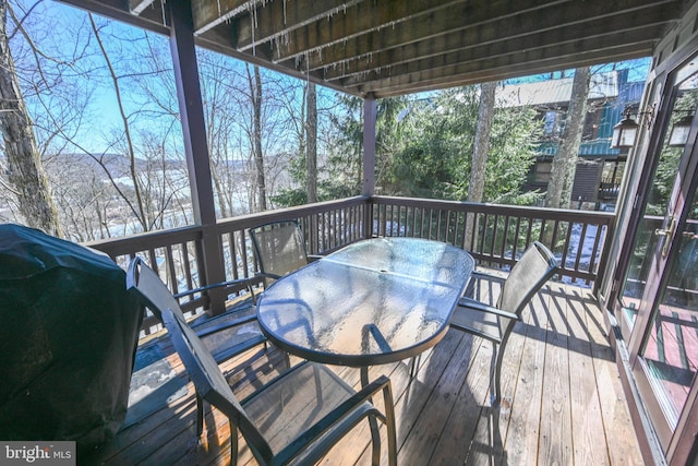 wooden terrace featuring a grill