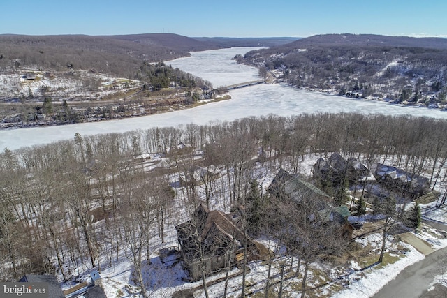 snowy aerial view featuring a mountain view