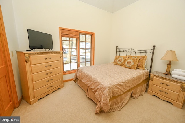 bedroom with light colored carpet