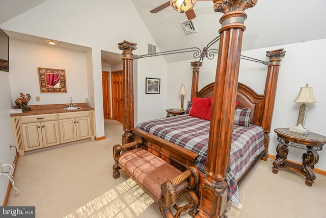 carpeted bedroom featuring high vaulted ceiling, wet bar, and ceiling fan